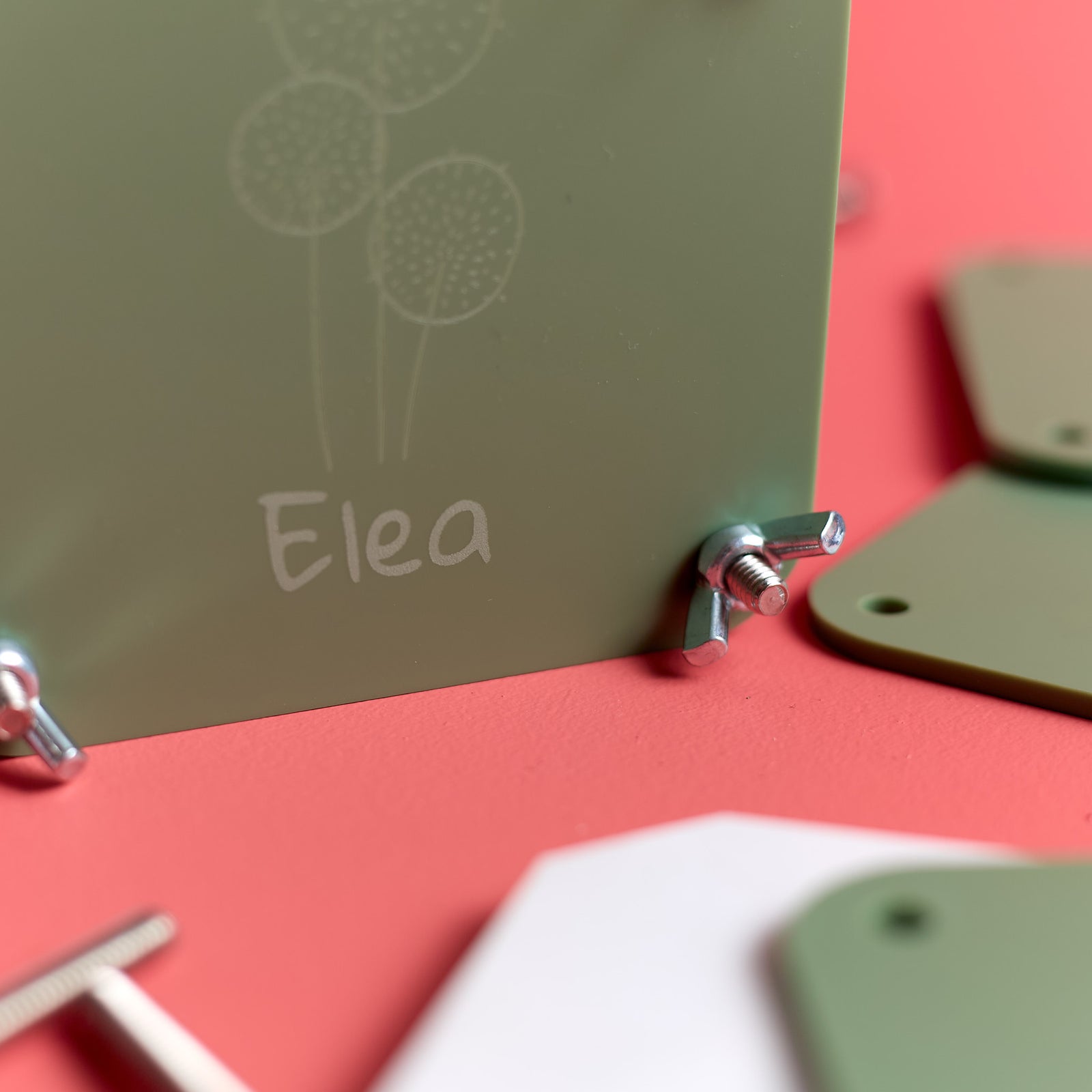 Close-up of a personalized assembled flower press from the ODIDOMI craft kit.