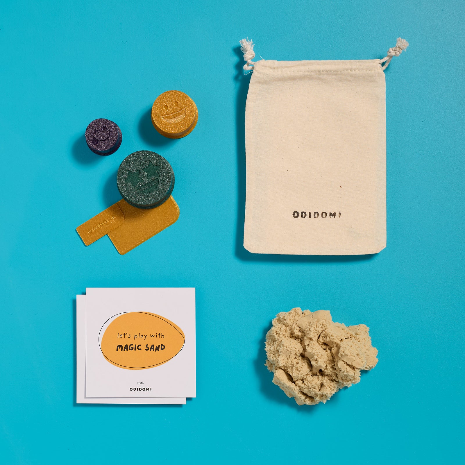 Flat lay of the complete ODIDOMI Magic Sand kit for kids.