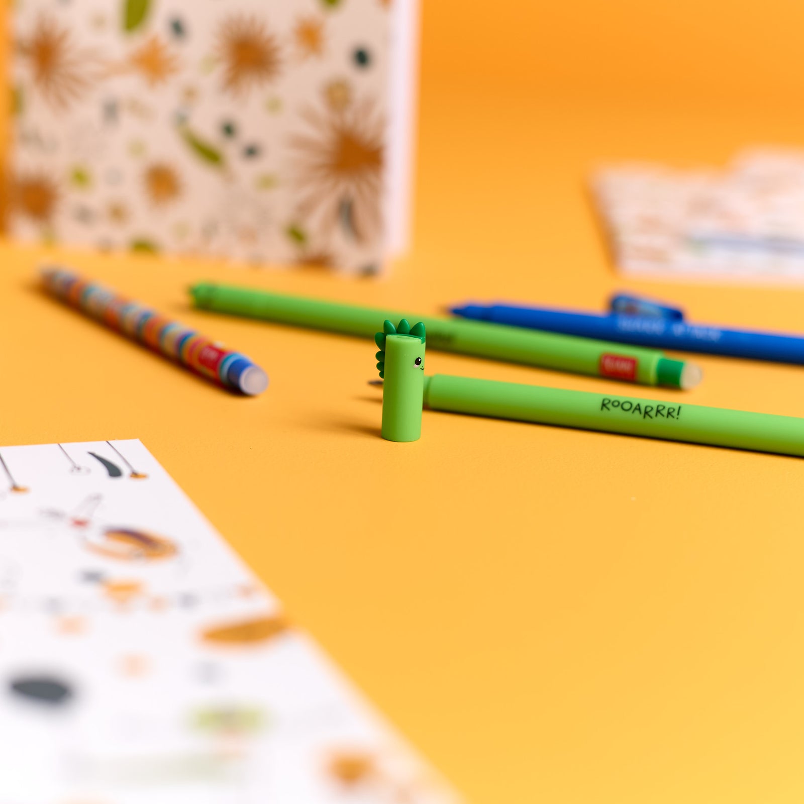 Close-up of the Dino Pen included in the ODIDOMI stationery kit.