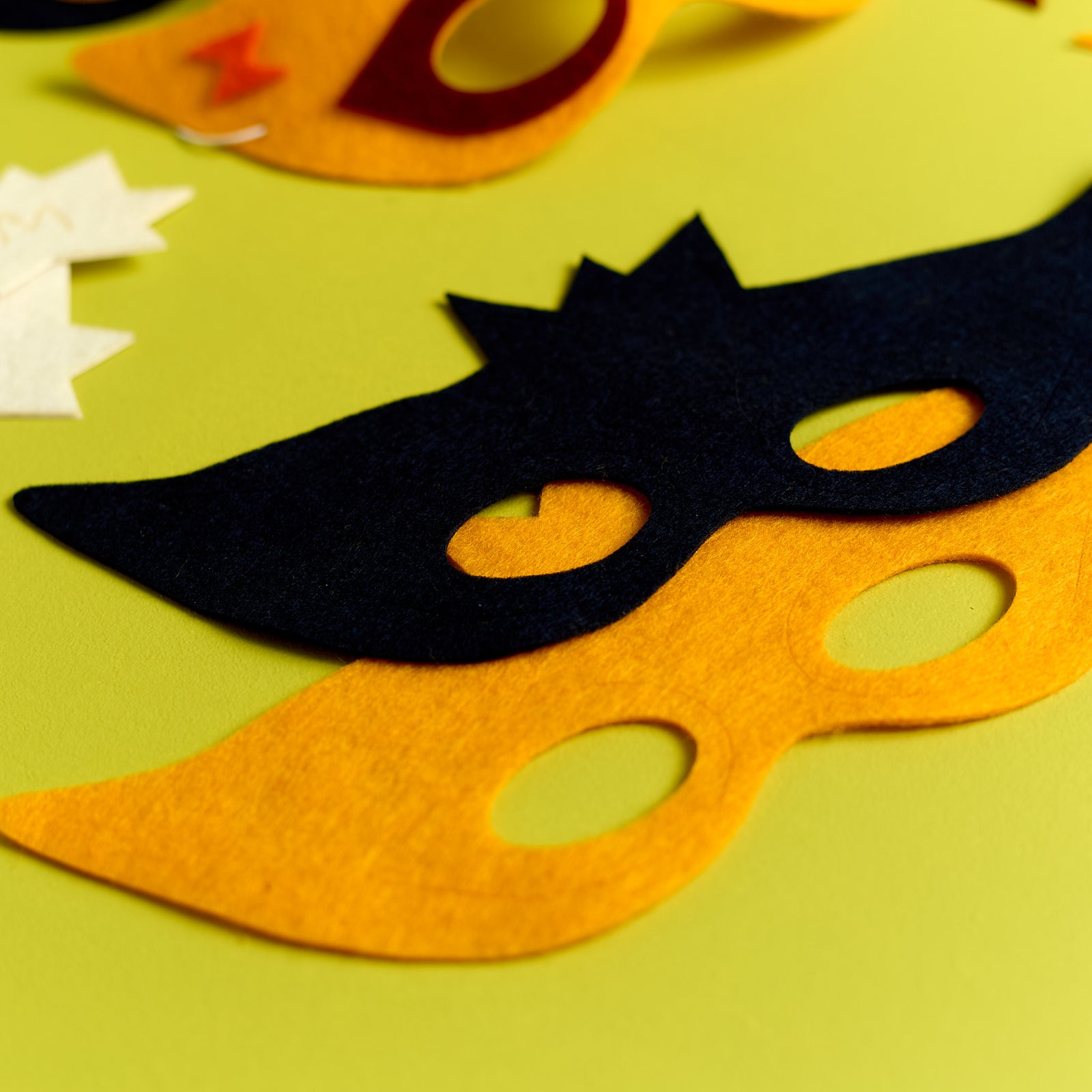 Close-up of the superhero mask template included in the ODIDOMI craft kit for kids.