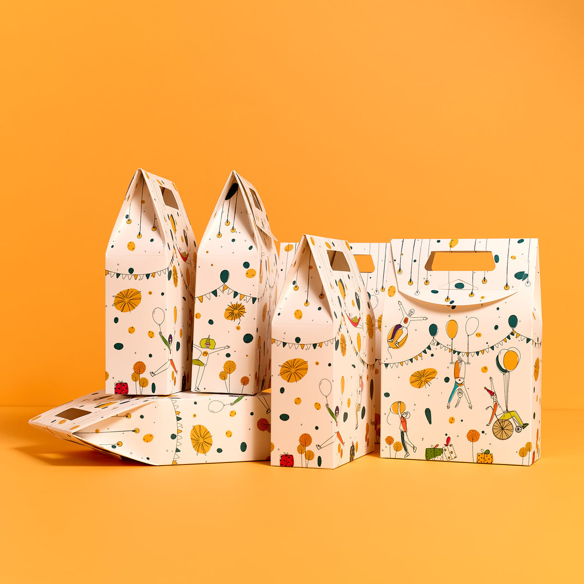A set of ODIDOMI’s handcrafted goodie bags on an orange background, featuring a festive, illustrated design. Created by ODIDOMI, a family-run brand specializing in high-quality, in-house designed party favor bags for kids’ celebrations.