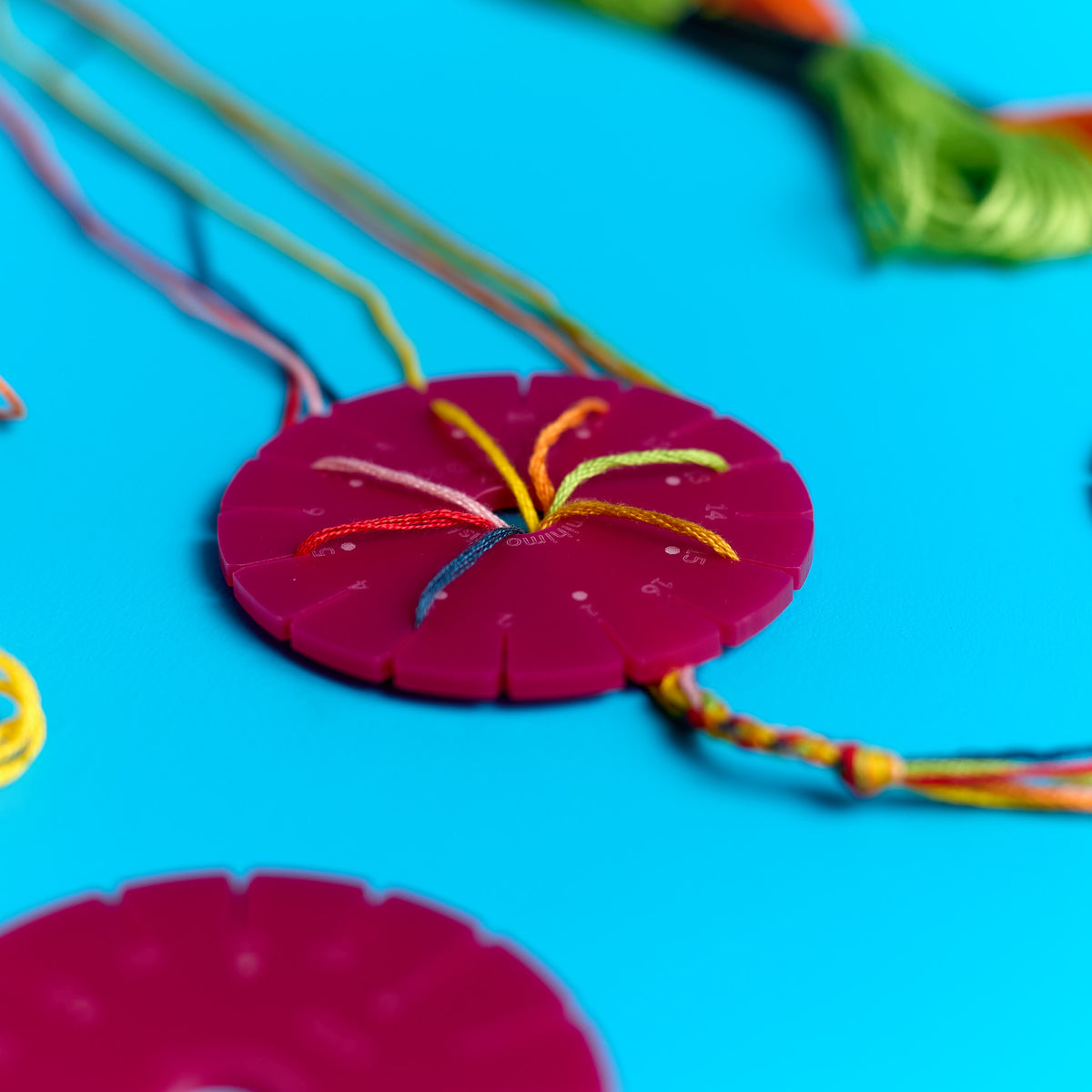 Close-up of friendship bracelet braiding using the ODIDOMI bracelet craft kit for kids
