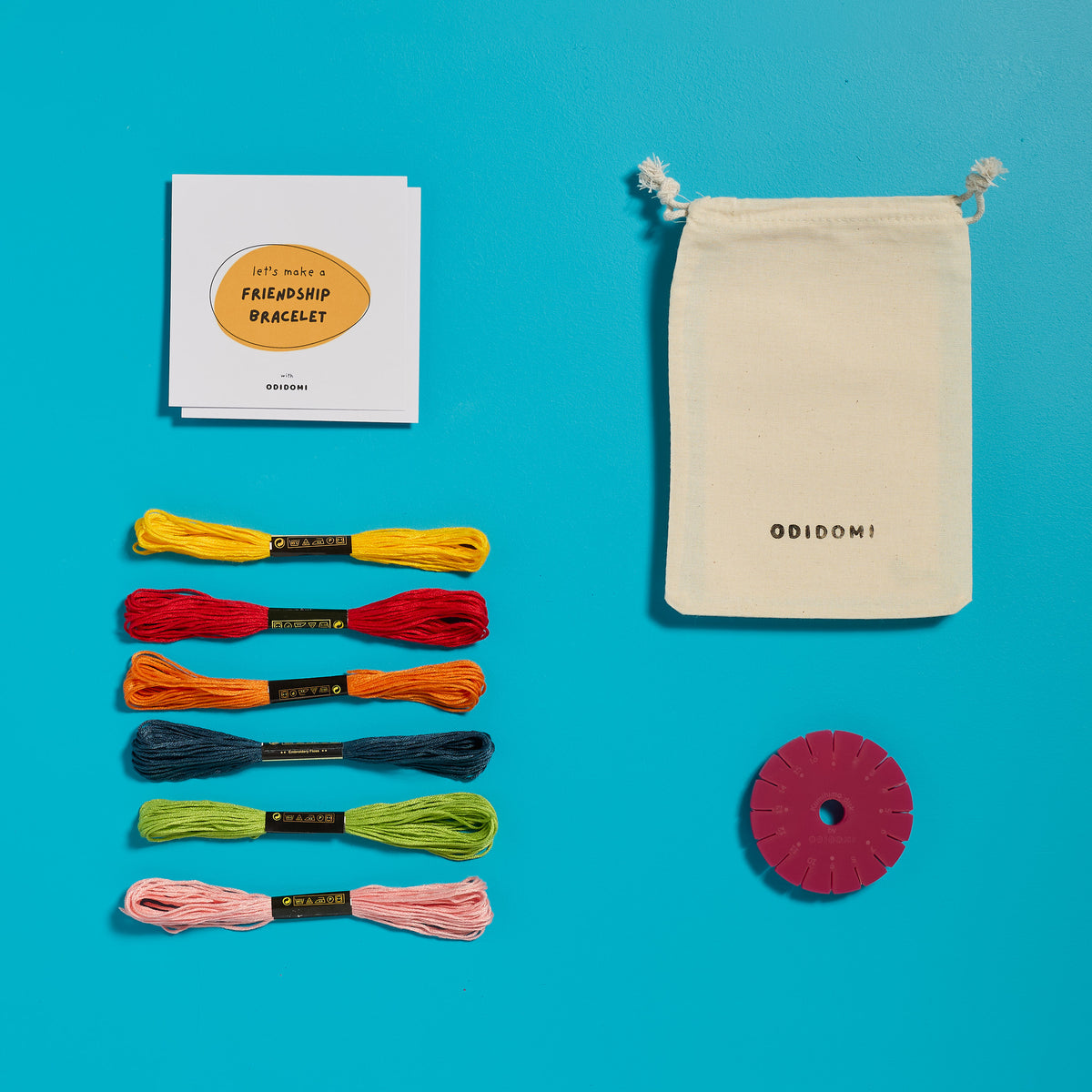 Flat lay of the complete ODIDOMI friendship bracelet kit for kids.
