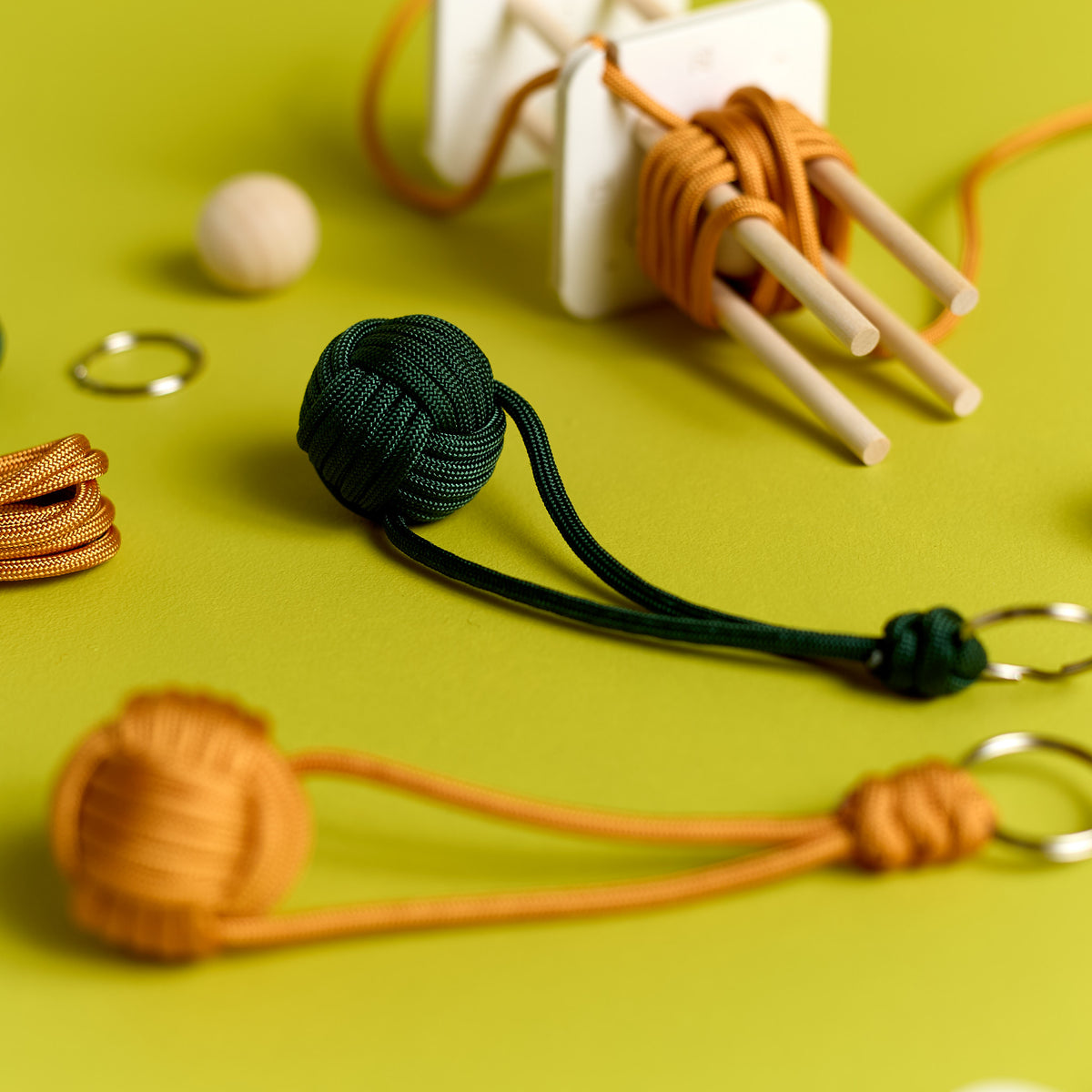 Close-up of finished Loop & Knot keychains created with the ODIDOMI craft kit for kids.