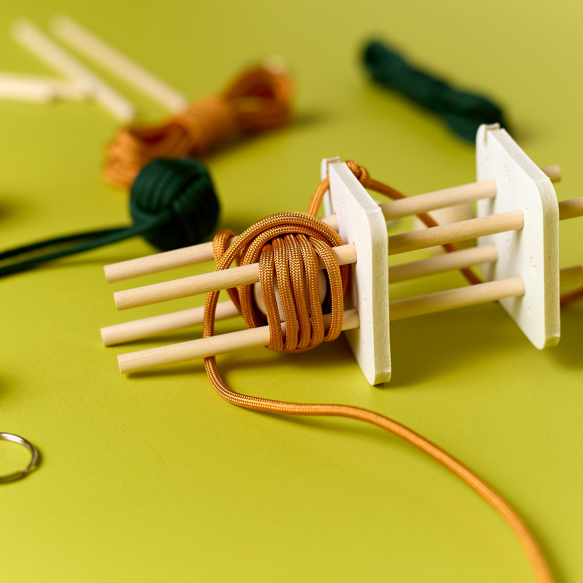 Close-up of the jig used in the ODIDOMI Loop & Knot Keychain craft kit.