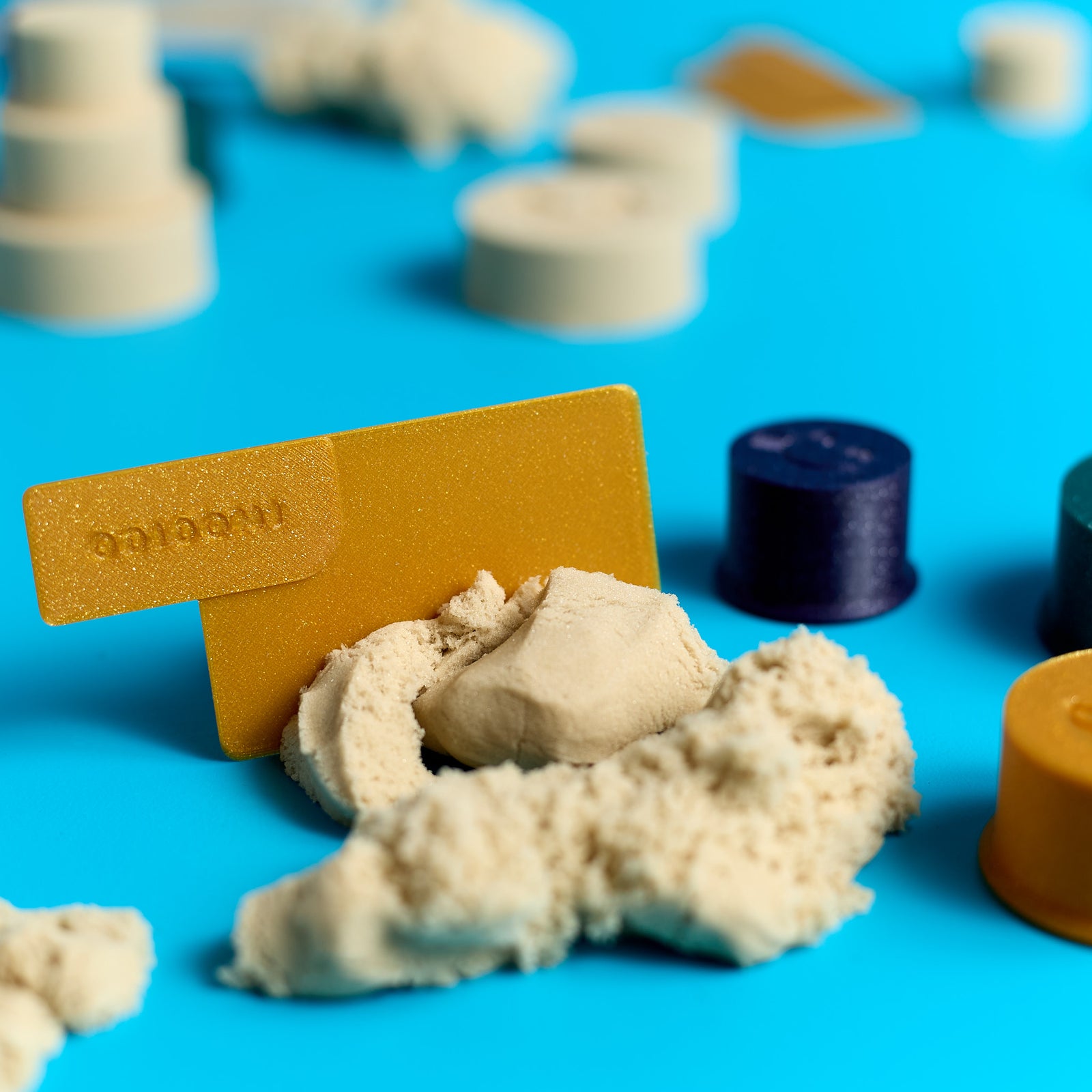 Close-up showing the texture of Magic Sand from the ODIDOMI sensory play kit.