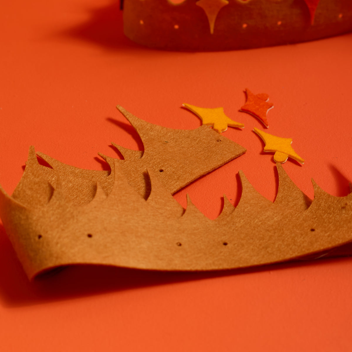 Close-up of felt decorations on a magical crown from the ODIDOMI craft kit for kids.