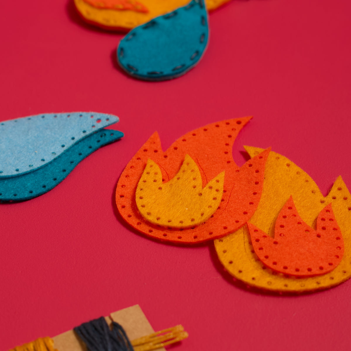 Pre-punched felt flame and water pieces included in the ODIDOMI Fire & Water Keychains Kit