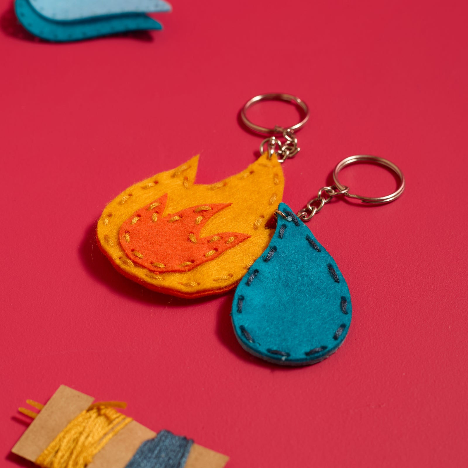 Handmade felt fire and water keychains created with the ODIDOMI sewing kit