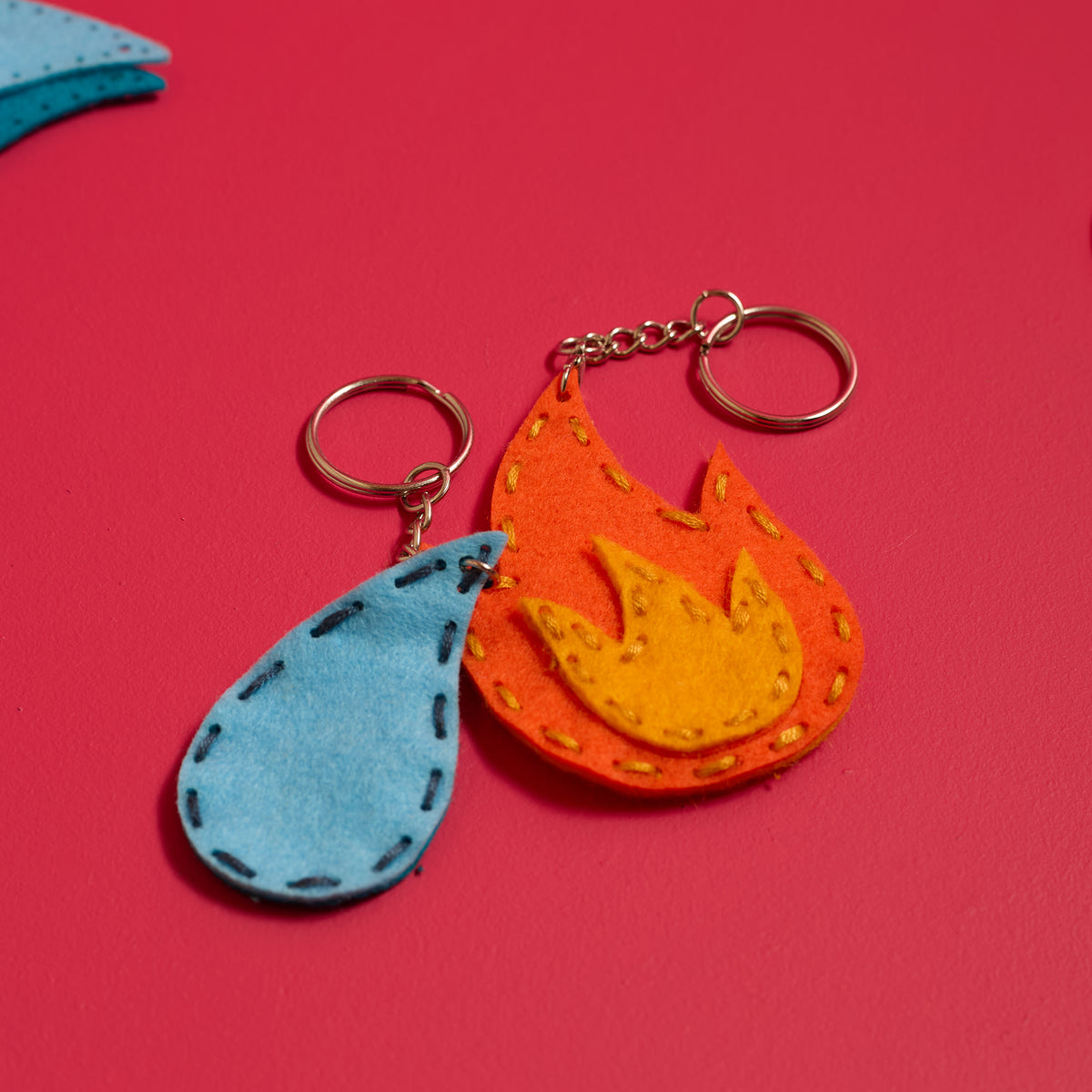 Handmade felt fire and water keychains created with the ODIDOMI sewing kit