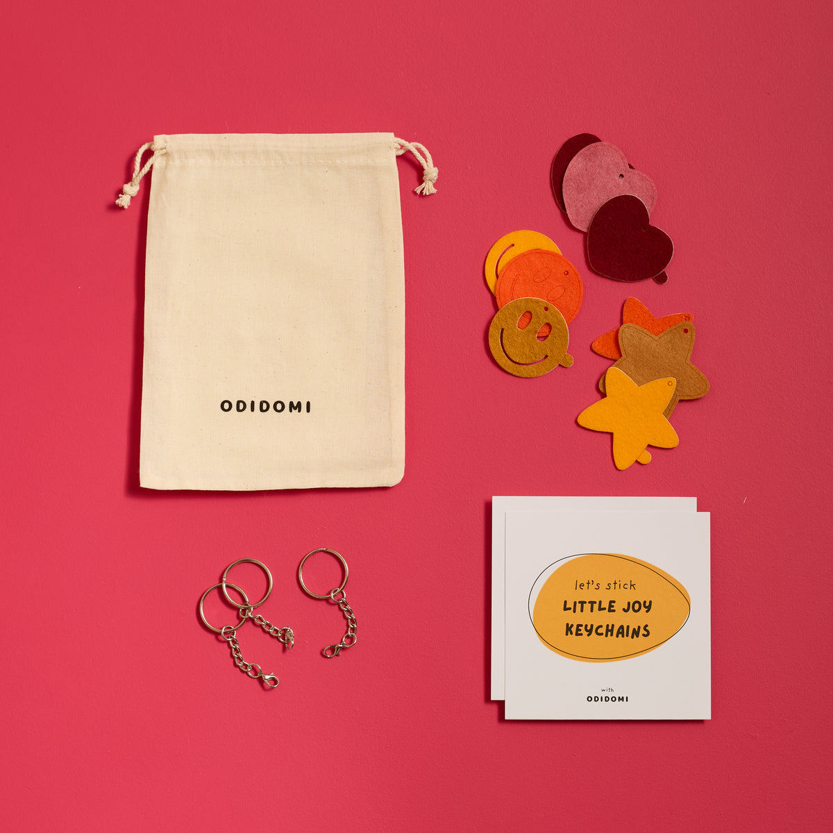 Flat lay of the complete ODIDOMI Little Joy Keychain Kit for kids.