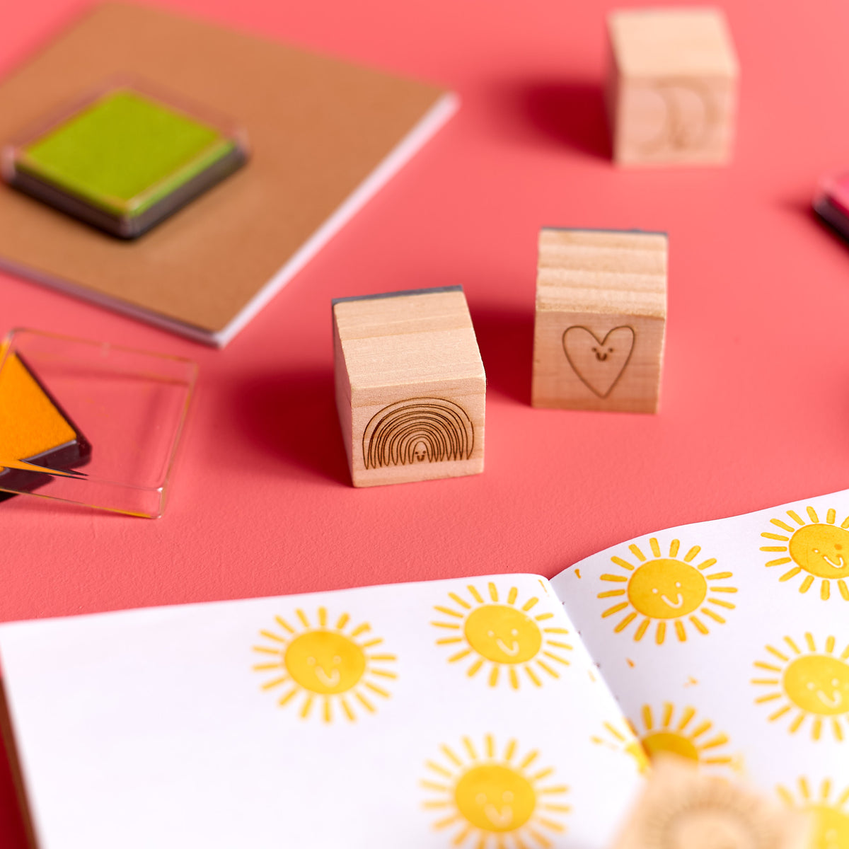 Close-up of stamps, notebook included in the ODIDOMI stamp kit.