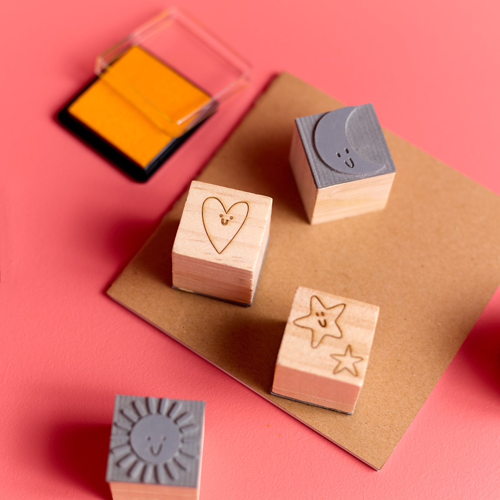 Close-up of a group of wooden stamps from the ODIDOMI stamp kit for kids.