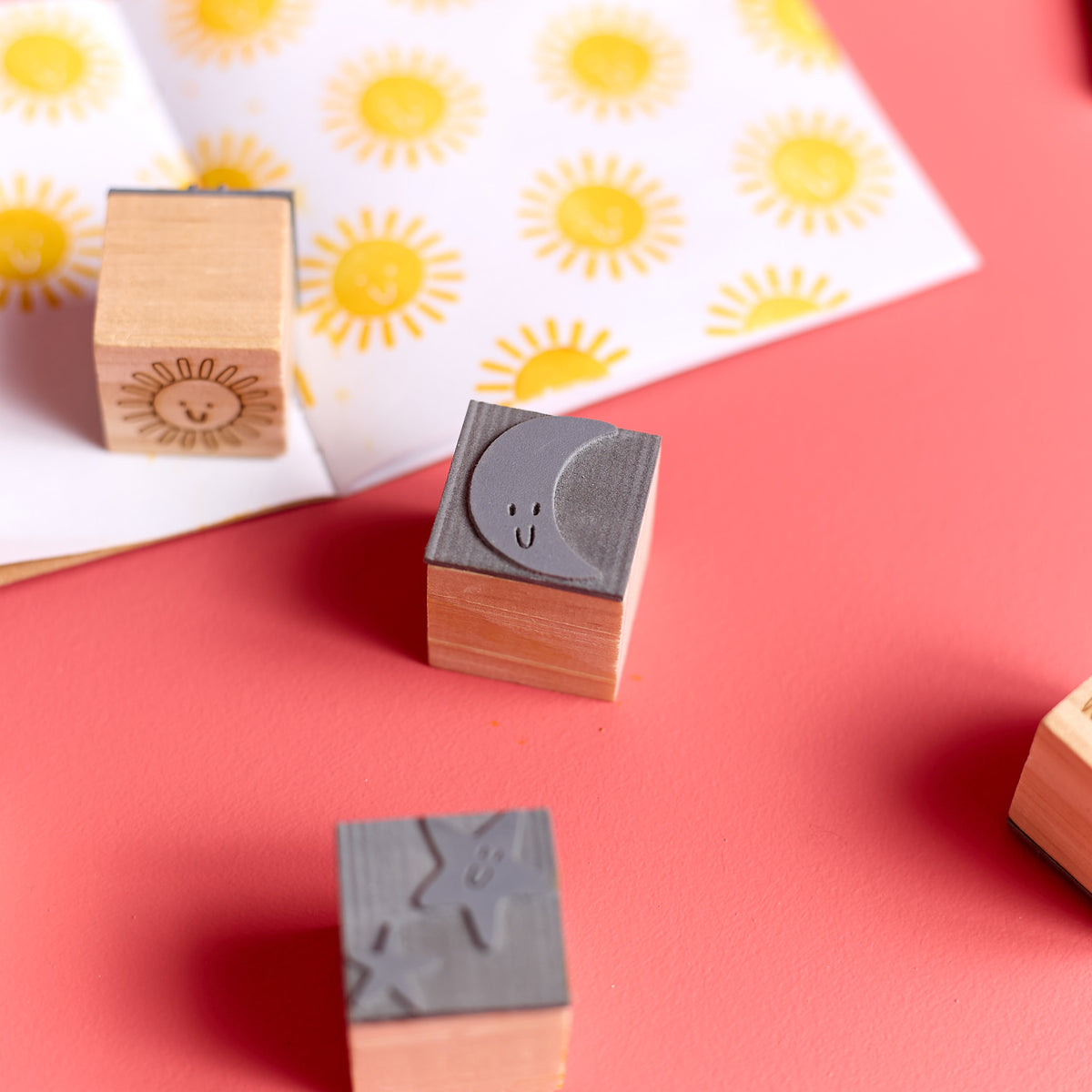 Close-up of the bottom side of wooden stamps included in the ODIDOMI stamp kit.