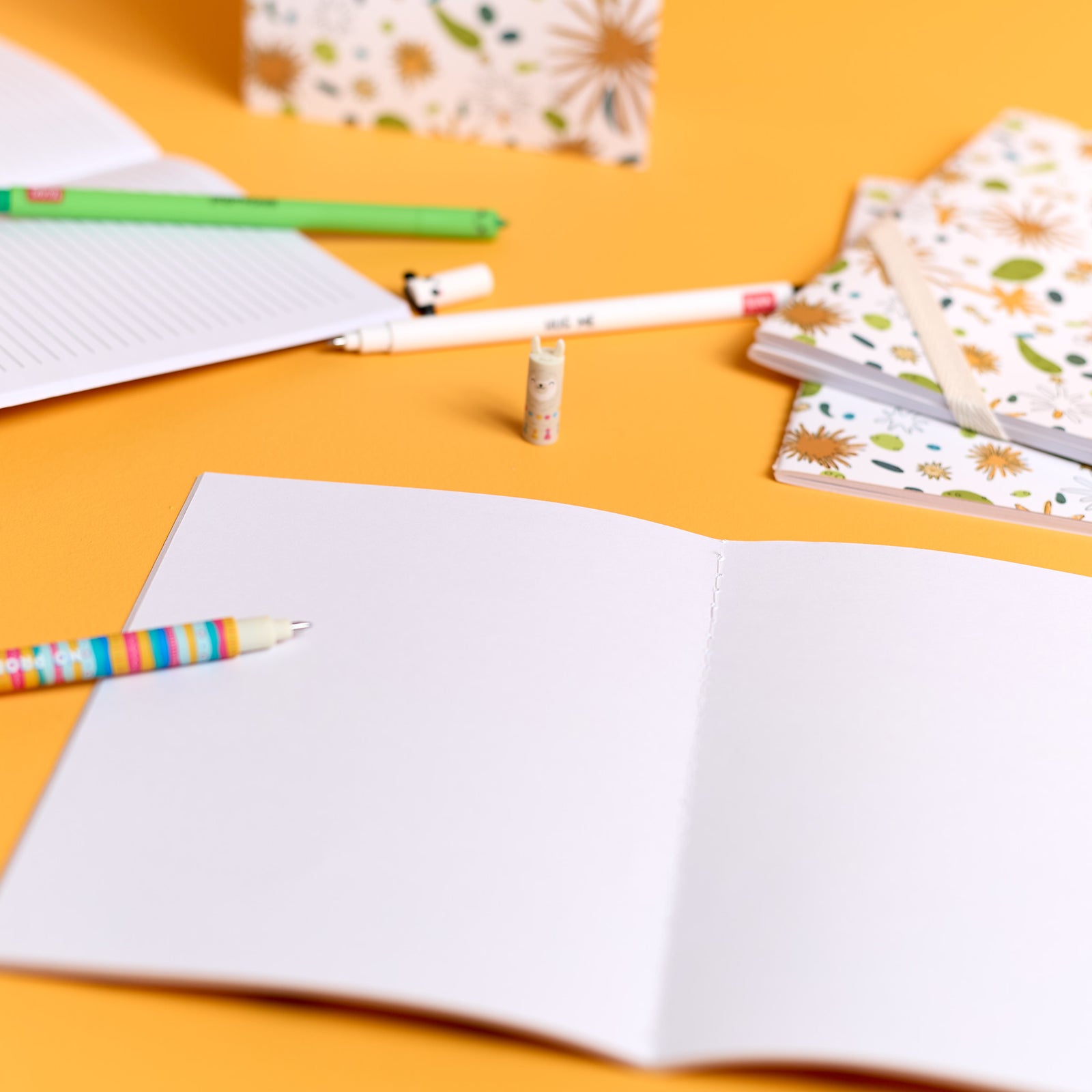 Close-up of open notebooks included in the ODIDOMI stationery kit.