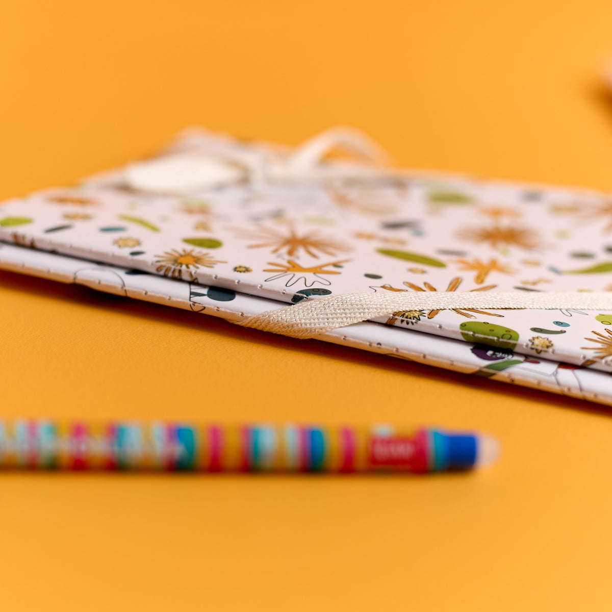 Close-up of the Llama Pen and notebooks included in the ODIDOMI stationery kit.