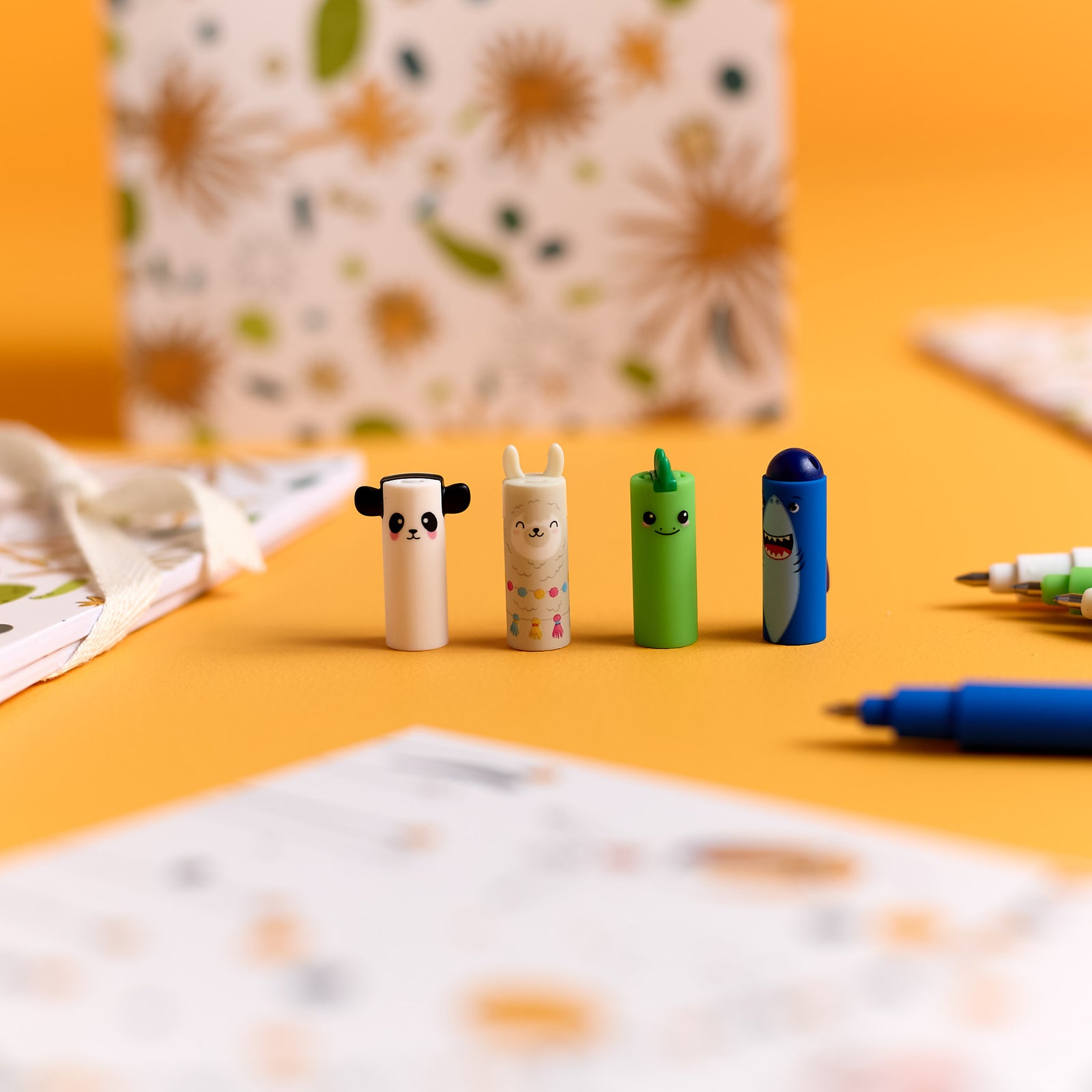Close-up of colorful pen caps included in the ODIDOMI stationery kit.