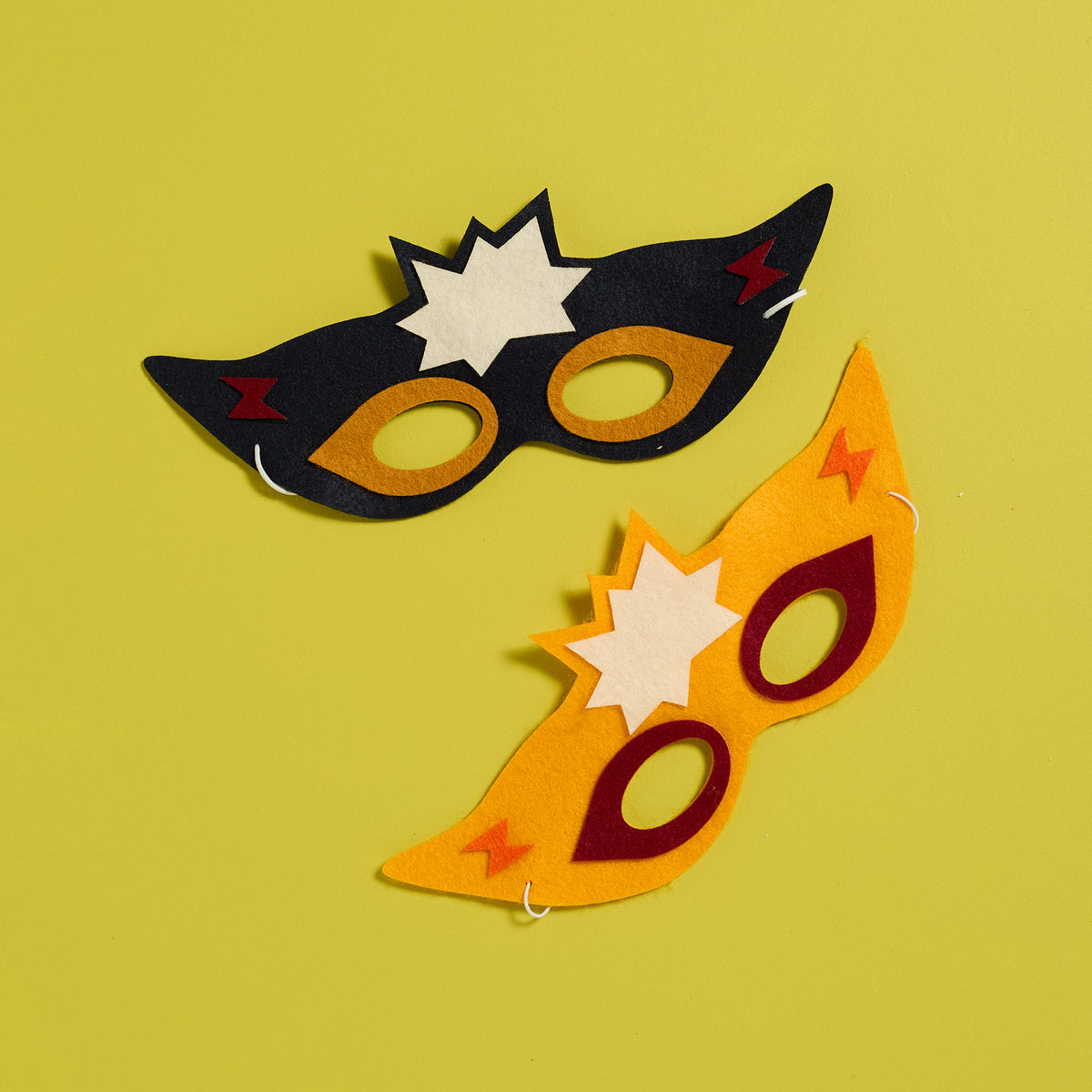 Overhead view of a finished Stick Superhero Mask from an ODIDOMI hands-on activity kit.