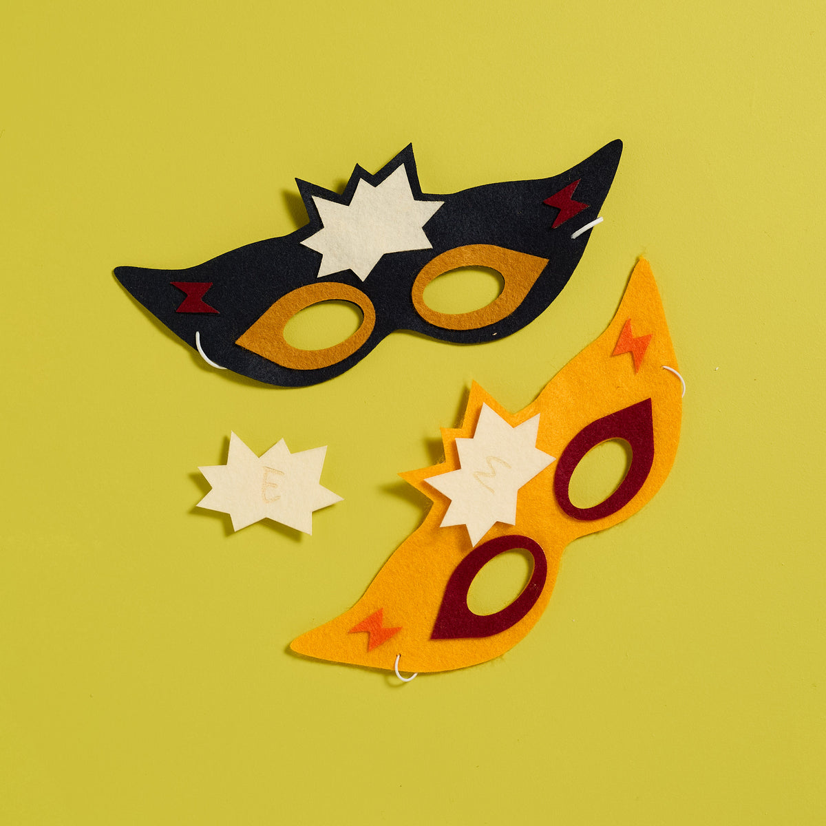Overhead view of a personalized Stick Superhero Mask created with an ODIDOMI craft kit for kids.