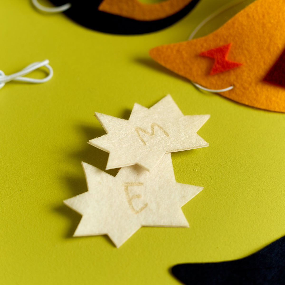 Close-up of personalized stickers included in the ODIDOMI Stick Superhero Mask kit.