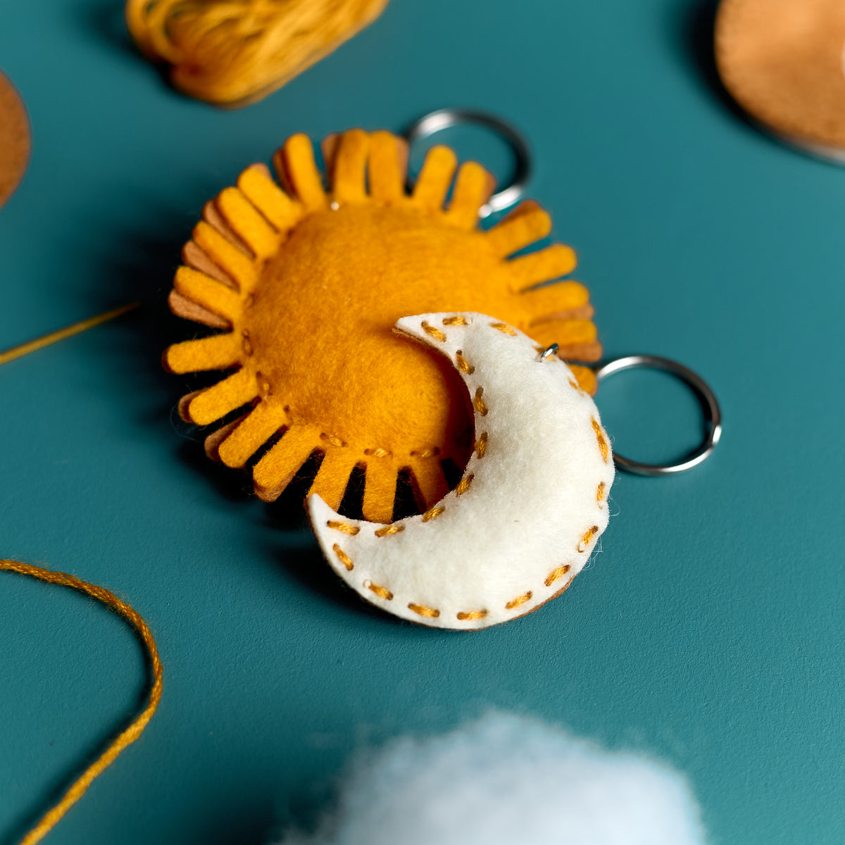 Close-up of a finished Sun & Moon keychain created with an ODIDOMI craft kit for kids.